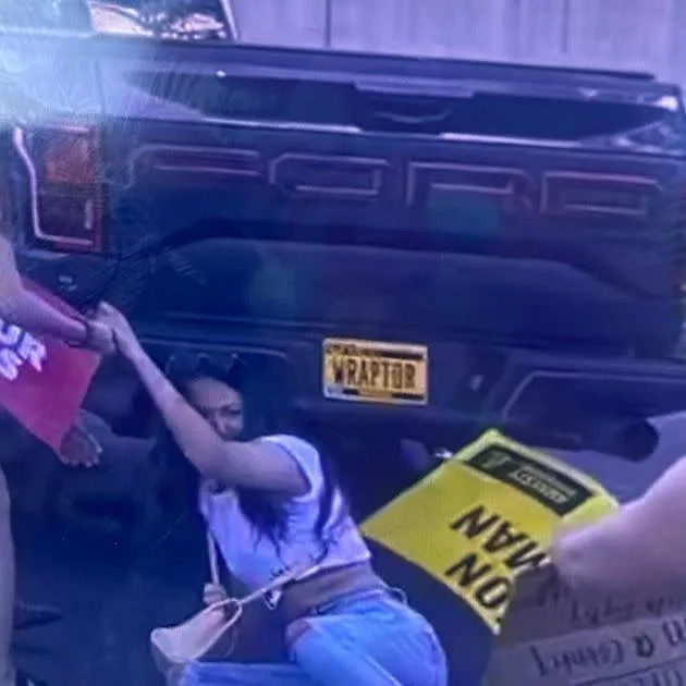 Protesters in Cedar Rapids, Iowa, fall as a driver careens into them during a demonstration Friday against the overturning of Roe v. Wade. (Photo: Lyz Lenz)