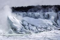 A partially frozen Niagara Falls is seen on the American side during sub-freezing temperatures in Niagara Falls, Ontario, March 3, 2014. REUTERS/Mark Blinch