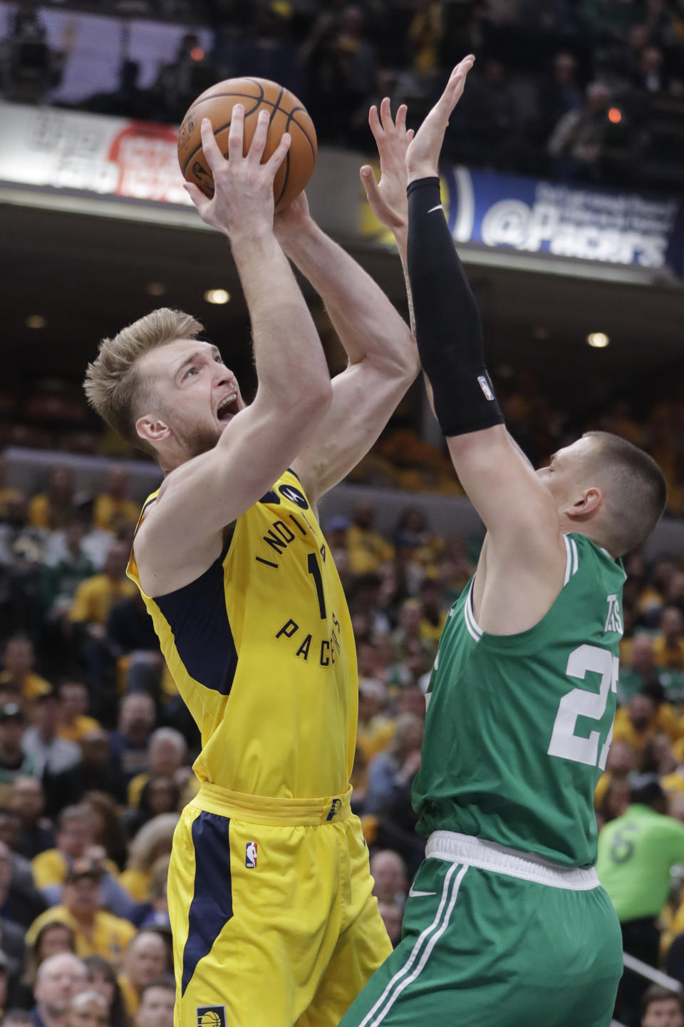 Indiana Pacers forward Domantas Sabonis (11) shoots over Boston Celtics forward Daniel Theis (27) during the first half of Game 3 of an NBA basketball first-round playoff series Friday, April 19, 2019, in Indianapolis. (AP Photo/Darron Cummings)