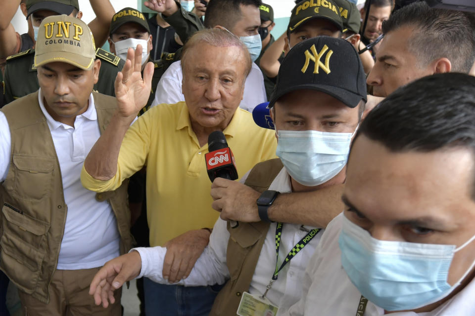 Rodolfo Hernandez, presidential candidate with the Anti-corruption Governors League, leaves a polling station after voting in presidential elections in Bucaramanga, Colombia, Sunday, May 29, 2022. (AP Photo/Mauricio Pinzon)