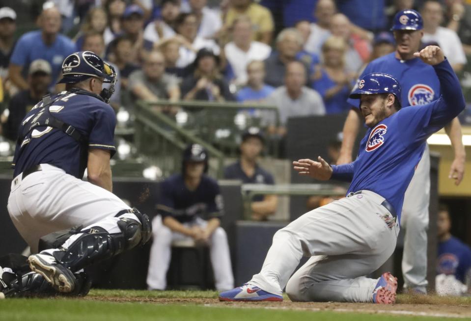 Milwaukee Brewers catcher Erik Kratz holds onto the ball after tagging out Chicago Cubs' Anthony Rizzo at home during the fifth inning of a baseball game Wednesday, Sept. 5, 2018, in Milwaukee. (AP Photo/Morry Gash)