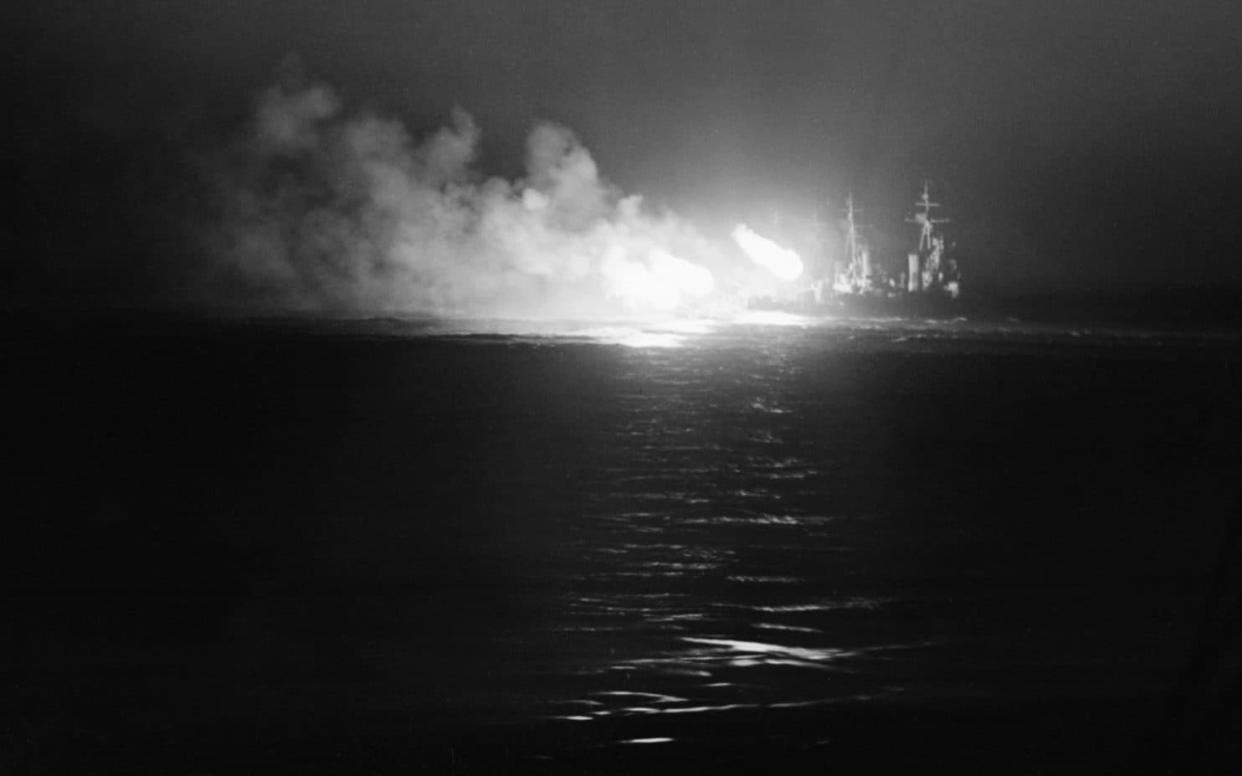 A DIDO class cruiser firing at night against Italian MAS boats in Operation Pedestal, 13 August 1942 - IWM/Getty Images 