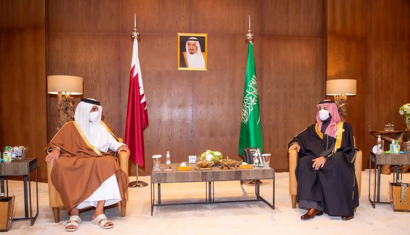 Saudi Arabia's Crown Prince Mohammed bin Salman meets Qatar's Emir Sheikh Tamim bin Hamad al-Thani during the Gulf Cooperation Council's (GCC) 41st Summit in Al-Ula