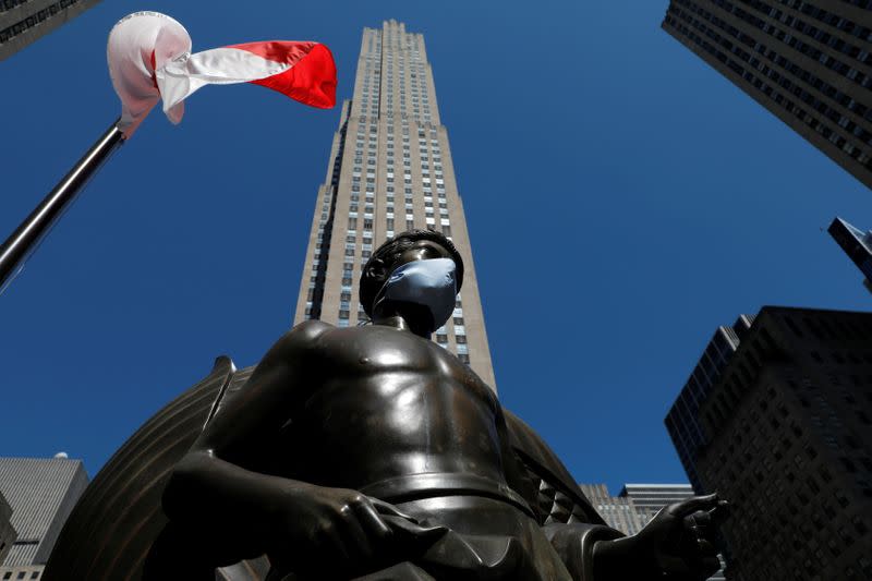 Statue at Rockefeller Center in Manhattan with face mask following outbreak of the coronavirus disease (COVID-19) in New York