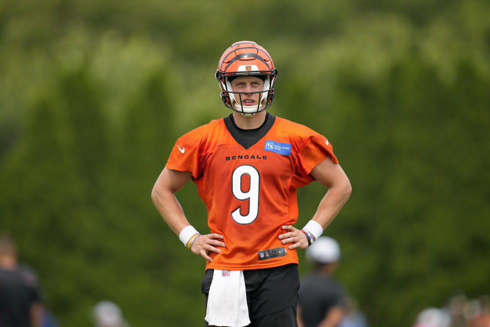 FILE - Cincinnati Bengals quarterback Joe Burrow (9) participates in a drill during the NFL football team's training camp, Thursday, July 27, 2023, in Cincinnati. Burrow was back at practice on Wednesday, Aug/. 30, 2023, more than a month after he was sidelined by strained right calf muscle.(AP Photo/Jeff Dean, File)