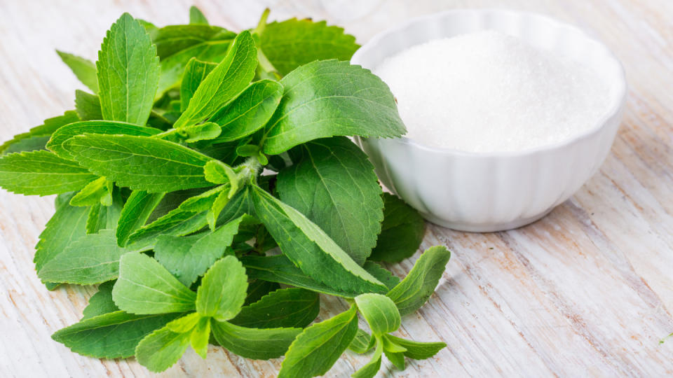 Stevia plant next to bowl of stevia: Allulose vs stevia