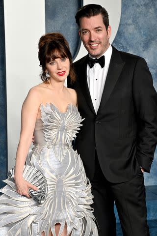 <p>Lionel Hahn/Getty</p> Jonathan Scott and Zooey Deschanel attend the 2023 Vanity Fair Oscar Party Hosted By Radhika Jones at Wallis Annenberg Center for the Performing Arts on March 12, 2023 in Beverly Hills, California.