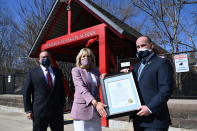 From left, Education Secretary Miguel Cardona, first lady Jill Biden and Meriden Mayor Kevin Scarpati Benjamin, pose for a photo outside Benjamin Franklin Elementary School, Wednesday, March 3, 2021 in Meriden, Ct. (Mandel Ngan/Pool via AP)