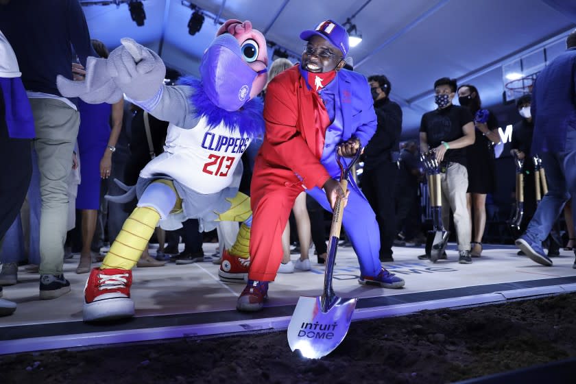 L.A. Clippers superfan Darrell Bailey aka Clipper Darrell, center, and Clippers mascot Chuck,