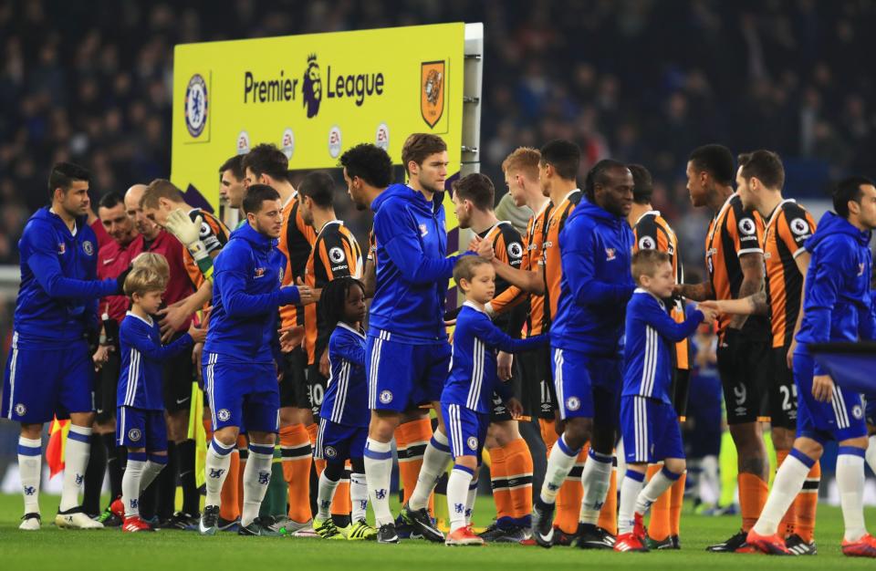 <p>The two teams line up before kick off </p>