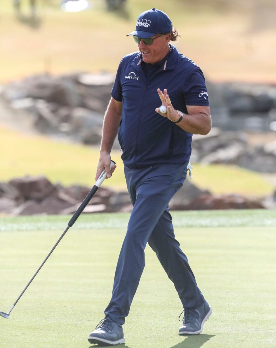 Phil Mickelson waves to fans after a birdie on hole 11 of the Pete Dye Stadium course during the third round of The American Express at PGA West in La Quinta, Calif., Saturday, Jan. 22, 2022. 