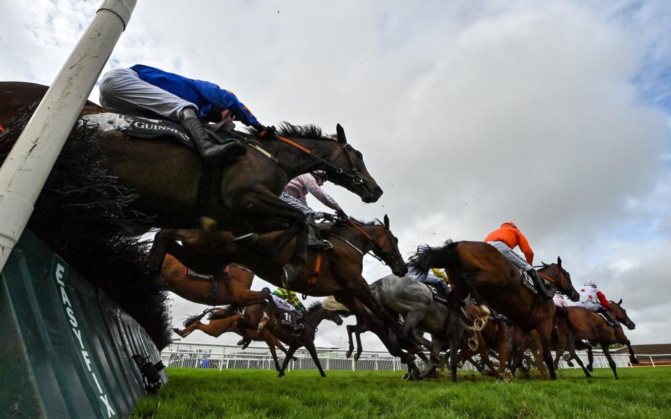 A general view of the runners and riders as they jump the seventh during the Guinness Galway Tribes Handicap Hurdle - Sportsfile