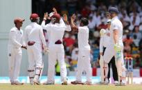 West Indies' Veerasammy Permaul celebrates taking the wicket of England's Ben Stokes Action Images via Reuters / Jason O'Brien Livepic