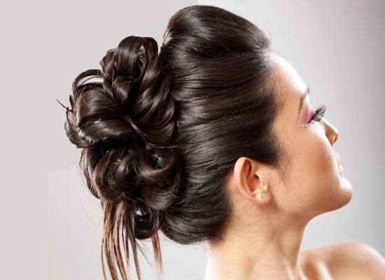 Bridal hairstyles that perfect for ceremony and reception : twisted low bun