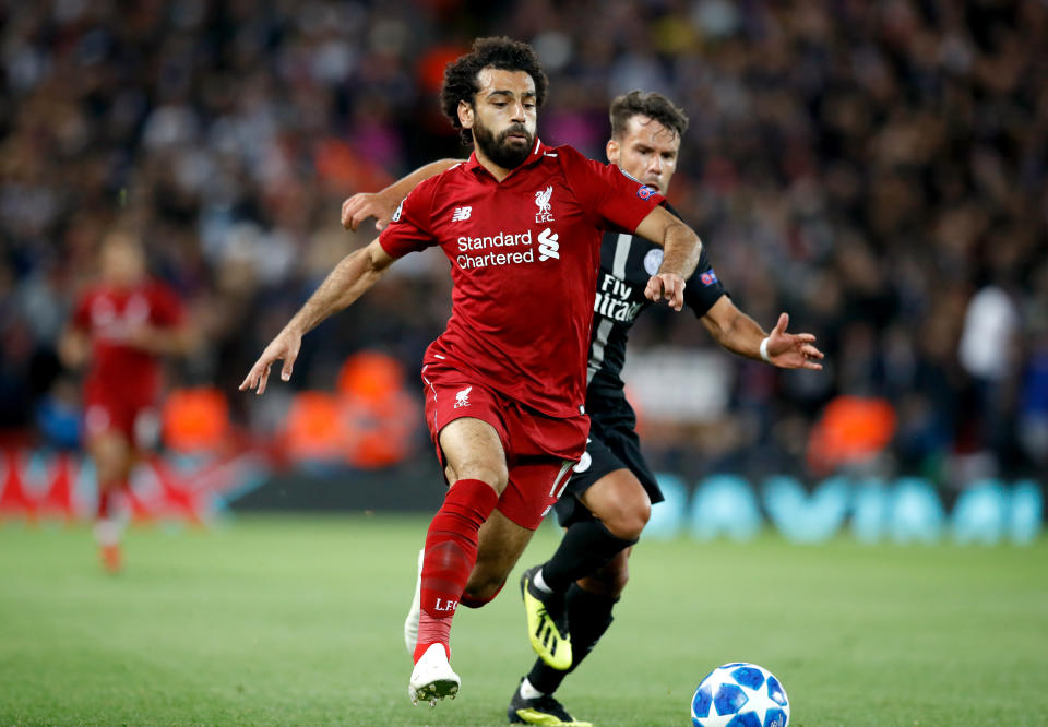 Liverpool’s Mohamed Salah (right) and Paris Saint-Germain’s Juan Bernat (left) battle for the ball