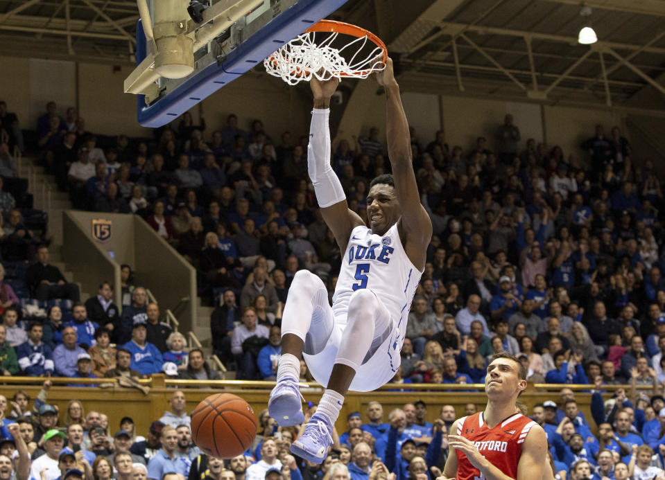 FILE - In this Dec. 5, 2018, file photo, Duke's RJ Barrett (5) dunks against Hartford during the second half of an NCAA college basketball game, in Durham, N.C. Barrett was named to the AP All-ACC team, Tuesday, March 12, 2019. (AP Photo/Ben McKeown, File)