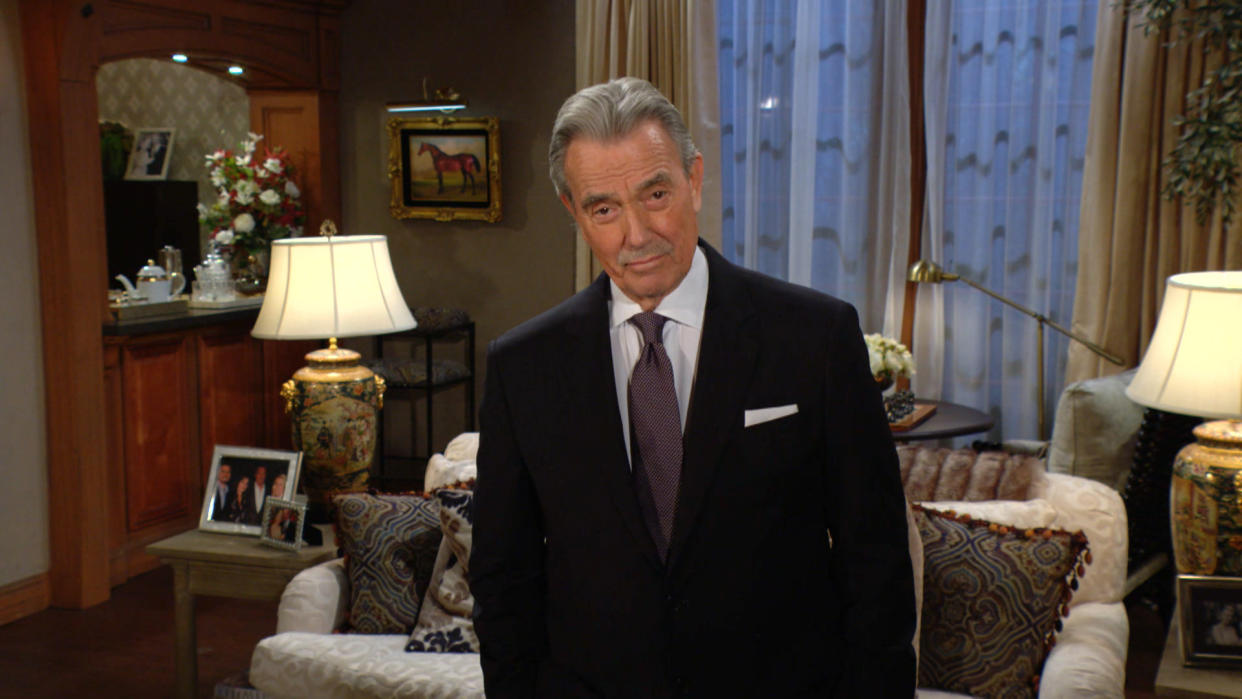  Eric Braeden as Victor Newman standing up smiling in The Young and the Restless 