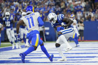 Indianapolis Colts' Zach Pascal (14) makes a touchdown reception against Los Angeles Rams' Darious Williams (11) during the second half of an NFL football game, Sunday, Sept. 19, 2021, in Indianapolis. (AP Photo/AJ Mast)