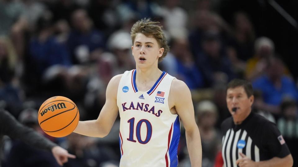 Kansas guard Johnny Furphy brings the ball up court