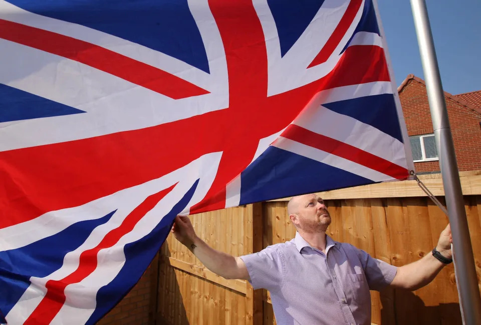 Ex-soldier Andrew Smith, 51, of Nottingham was told by a housing developer to stop flying his Union Jack flag. (SWNS)