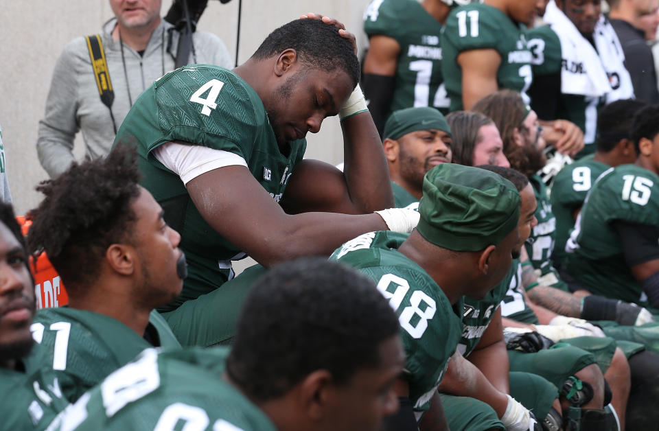 Malik McDowell #4 of the Michigan State Spartans sits on the bench late in the fourth quarter during the game against the Michigan Wolverines at Spartan Stadium on Oct. 29, 2016 in East Lansing, Michigan. Michigan defeated Michigan State 32-23. Leon Halip/Getty Images