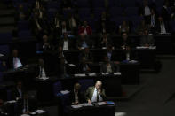 <p>Alexander Gauland, center, co-faction leader of the Alternative for Germany party sits in the sun light during a plenary session of the German parliament Bundestag about the budget 2019, in Berlin, Tuesday, Sept. 11, 2018. (AP Photo/Markus Schreiber) </p>