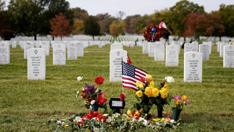 FILE - Flowers rest at the burial plot of former Secretary of State Colin Powell in Section 60 at Arlington National Cemetery, Nov. 11, 2021, in Arlington, Va. (Patrick Semansky/AP, File)