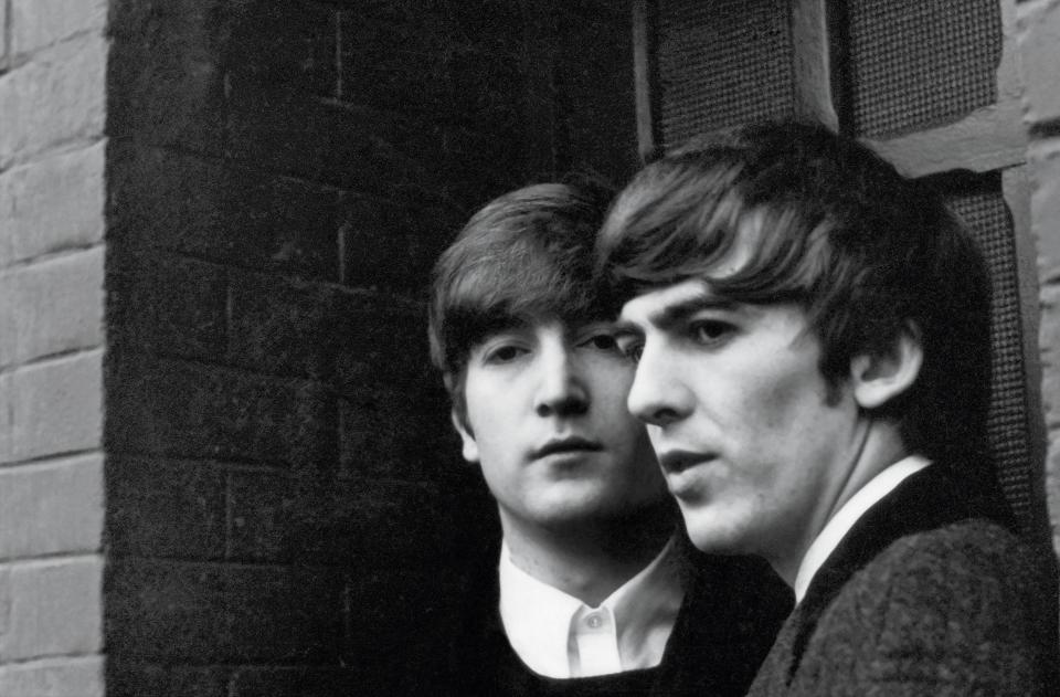 John Lennon and George Harrison, photographed in Paris in 1964, where they received word that “I Want to Hold Your Hand” had hit No. 1 in the States.