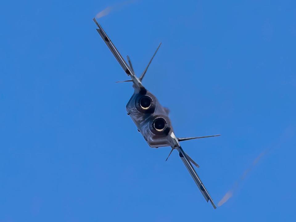 J-20 stealth fighter jet flies in the sky before the upcoming Airshow China 2021 on September 25, 2021 in Zhuhai, Guangdong Province of China.