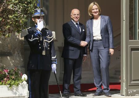French Interior Minister Bernard Cazeneuve (L) welcomes Britain's Home Secretary Amber Rudd before a meeting in Paris, France, August 30, 2016. REUTERS/Gonzalo Fuentes