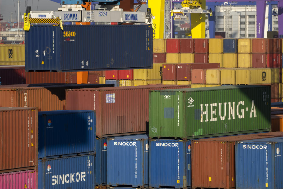 A crane lifts a shipping container at an automated port in Tianjin, China, Monday, Jan. 16, 2023. China's exports fell 7.5% from a year ago in May, 2023, and imports were down 4.5%, adding to signs an economic recovery is slowing. (AP Photo/Mark Schiefelbein)