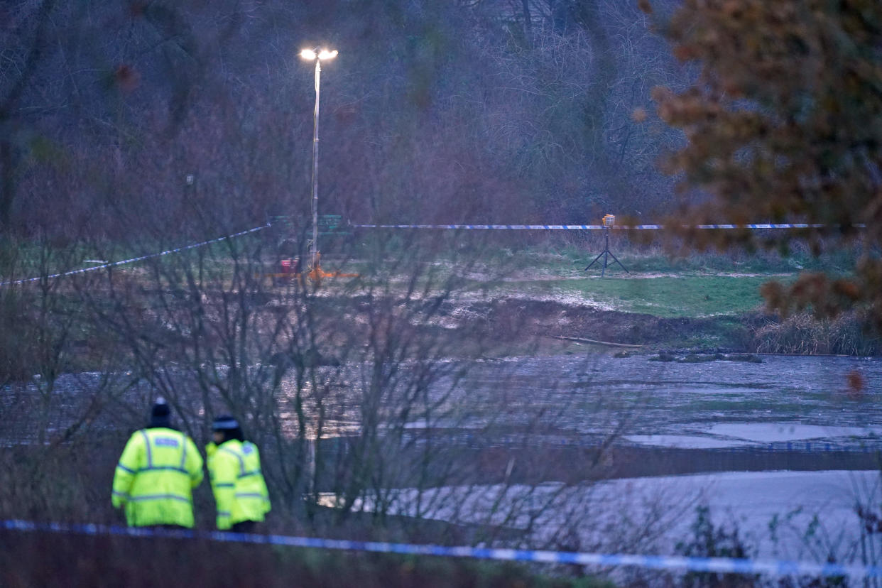 The scene in Babbs Mill Park in Kingshurst, Solihull. Four children are in critical condition in hospital after being pulled from an icy lake in cardiac arrest, while a search operation continues amid fears two more children were involved in the incident. Picture date: Monday December 12, 2022.