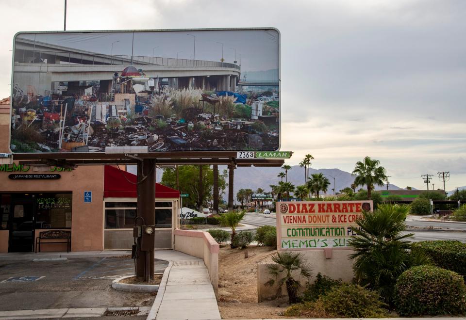 A billboard featuring a photograph by Thomas Broening depicting the housing crisis is seen along Ramon Road in Cathedral City, Calif., Saturday, Aug. 13, 2022. 