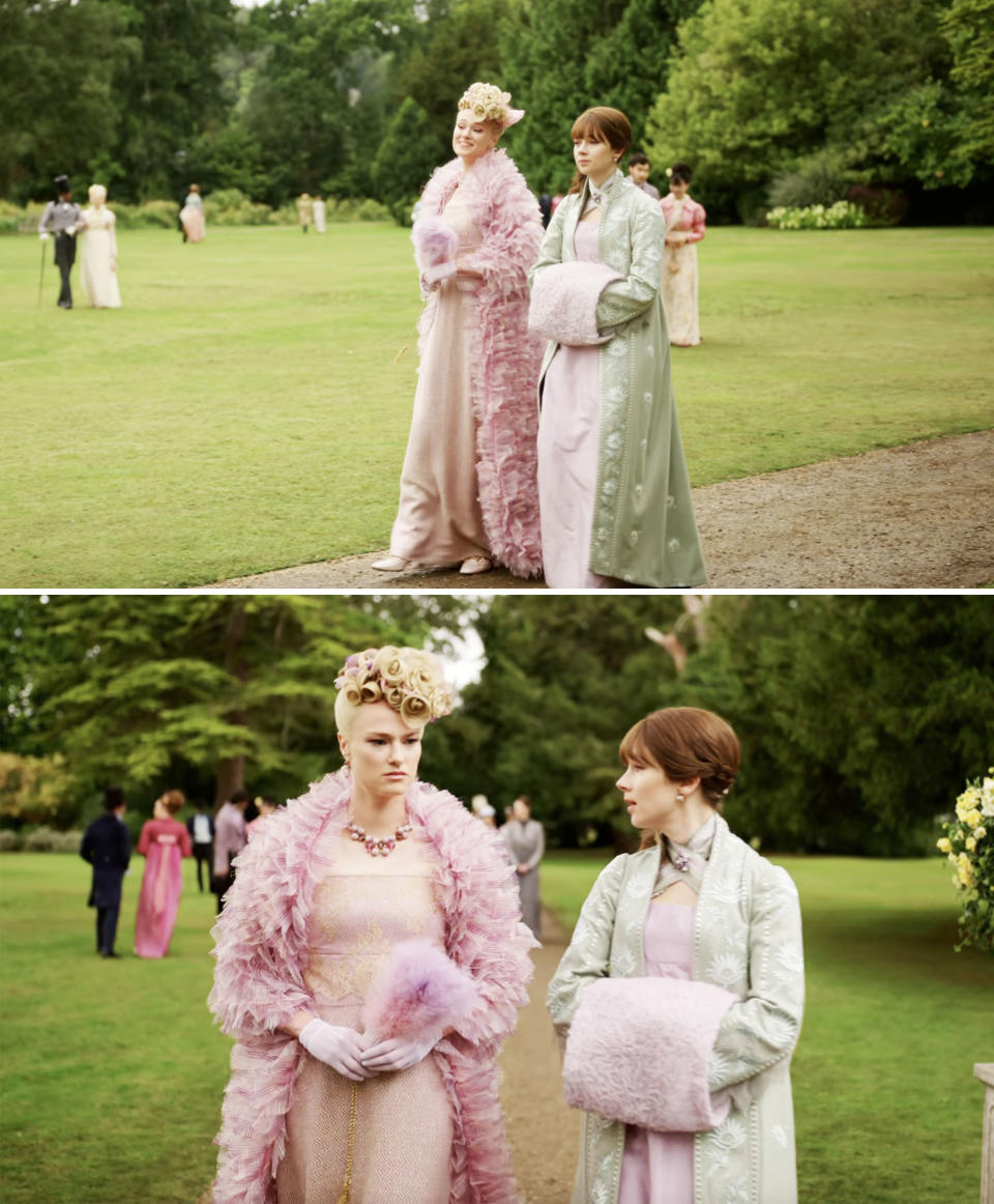 Cressida and Eloise from "Bridgerton" are strolling on a garden path, wearing elegant pastel-colored period dresses