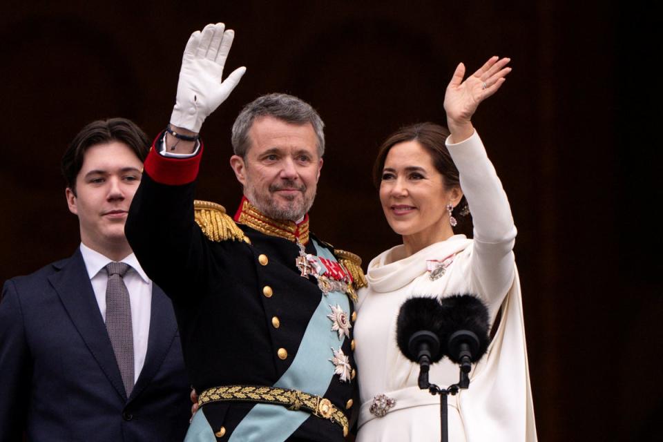 Denmark's newly proclaimed King Frederik and Queen Mary wave on the balcony of Christiansborg Palace (Reuters)