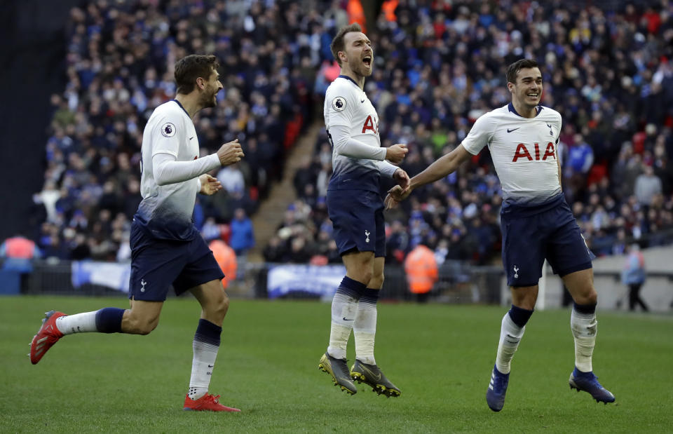 Tottenham Hotspur's Christian Eriksen, center, celebrates after scoring his side's second goal during the English Premier League soccer match between Tottenham Hotspur and Leicester City at Wembley stadium in London, Sunday, Feb. 10, 2019. (AP Photo/Matt Dunham)