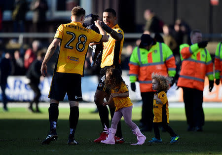 Soccer Football - FA Cup Third Round - Newport County AFC vs Leeds United - Rodney Parade, Newport, Britain - January 7, 2018 Newport County's Joss Labadie and Mickey Demetriou celebrate after the match REUTERS/Rebecca Naden