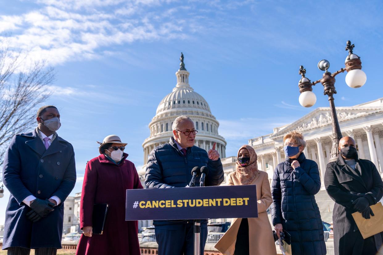 Senate Majority Leader Sen. Chuck Schumer of N.Y., center, accompanied by from left, Rep. Mondaire Jones, D-N.Y., D-Mass., Rep. Alma Adams, D-N.C., Rep. Ilhan Omar, D-Minn., Sen. Elizabeth Warren, D-Mass., and Rep. Ayanna Pressley, speaks at a news conference on Capitol Hill in Washington, Thursday, Feb. 4, 2021, about plans to reintroduce a resolution to call on President Joe Biden to take executive action to cancel up to $50,000 in debt for federal student loan borrowers. 