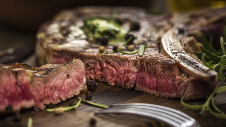 Steak with herbs and fork