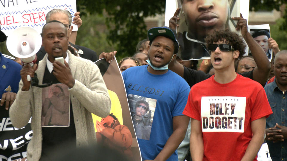 Families and supporters of police victims Samuel Sterling and Riley Doggett, Friday, June 7, at the Michigan Capitol (WLNS)