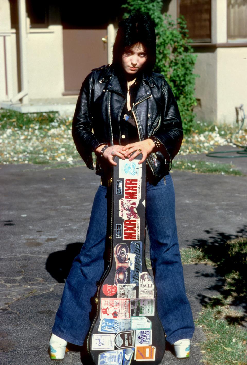 Jett poses for a portrait by her family's home in Canoga Park just outside Los Angeles, in the late '70s.&nbsp;