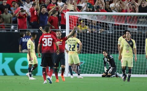 Juan Mata celebrates equalising for United - Credit: ap