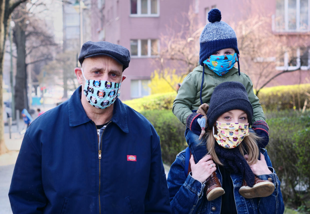 28 March 2022, Berlin: A family goes for a walk in Friedenau. All family members wear colorful masks as protection against the coronavirus. The masks were sewn by a friend of the family herself. Photo: Wolfram Steinberg/dpa (Photo by Wolfram Steinberg/picture alliance via Getty Images)