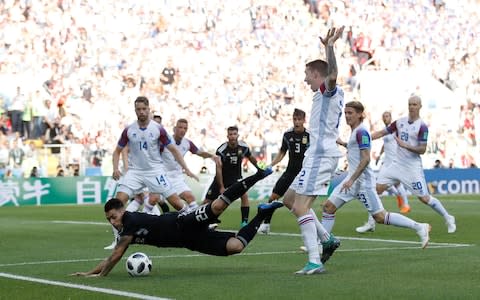 Argentina's Cristian Pavon goes down in the penalty area after a challenge by Iceland's Birkir Mar Saevarsson - Is VAR getting it right in Russia? - Credit: Carl Recine/Reuters 