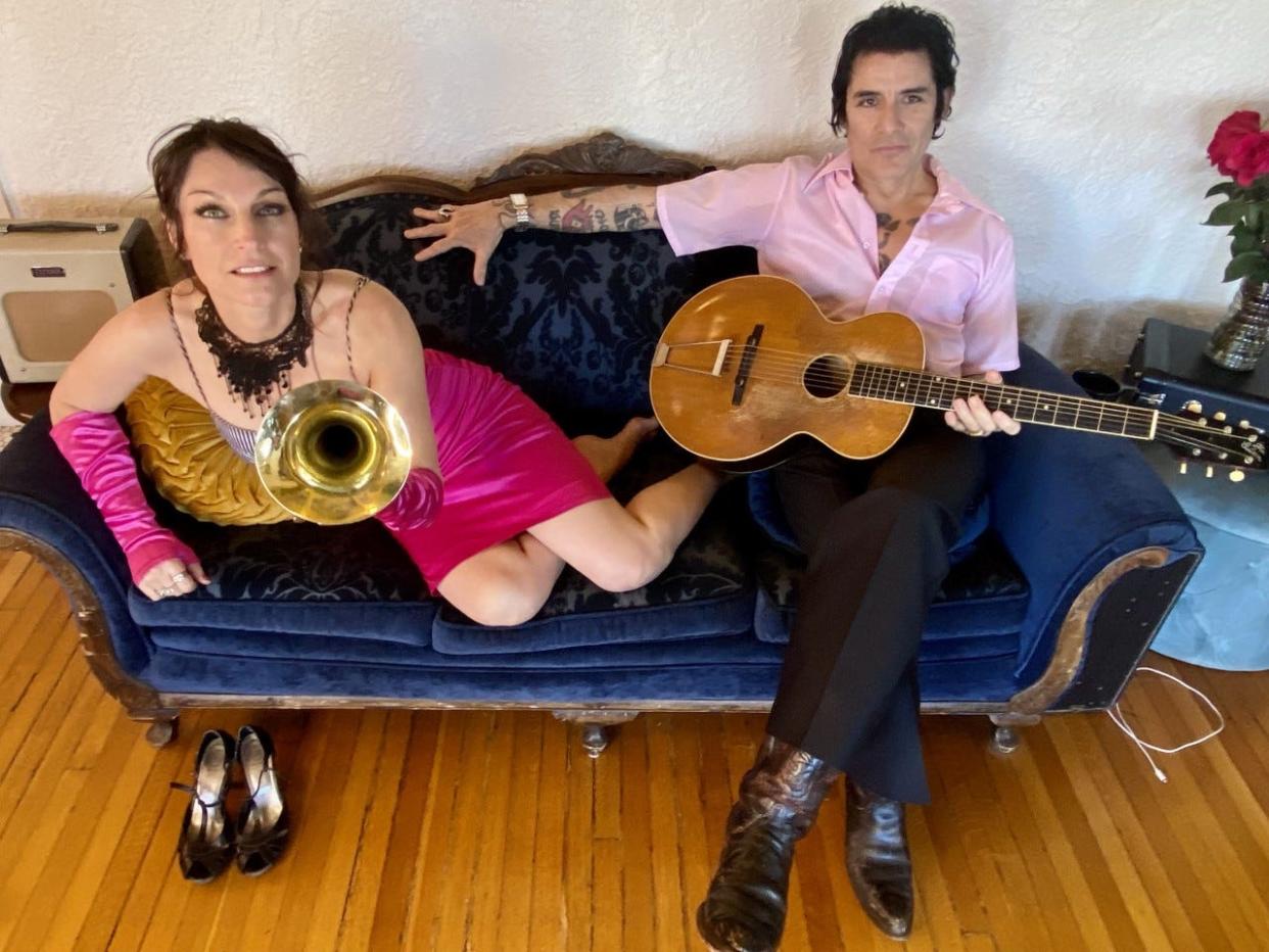 Leilainia Marcus and Stephen Rey pose for a photo in their Sunset Heights apartment. The two make up the heart of the band Tormenta Rey, which is releasing its self-titled debut album on Valentine's Day.