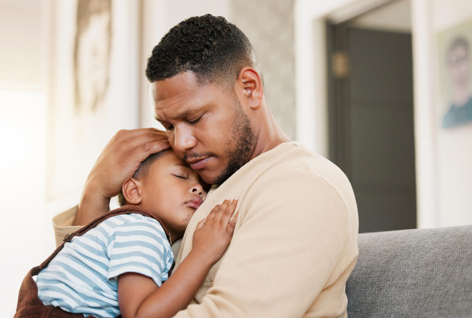 father holding is child