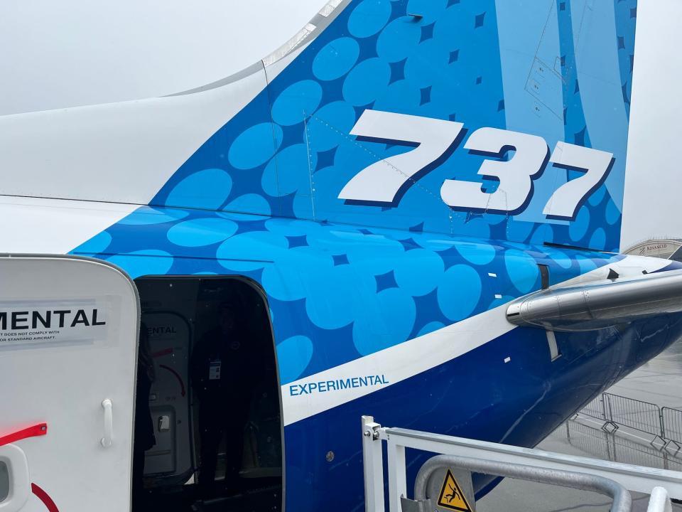 The tail of the 737 MAX 10 with the Boeing livery.