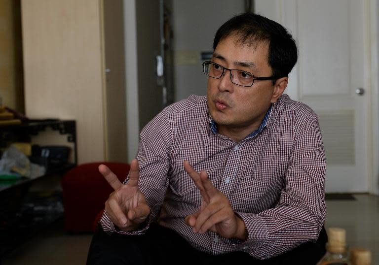 Lawyer Le Cong Dinh speaks to AFP during an interview at his home in Ho Chi Minh City on April 10, 2015