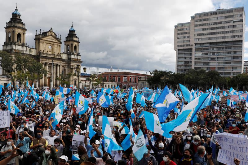 Demonstrators take part in a protest demanding the resignation of President Alejandro Giammattei, in Guatemala City