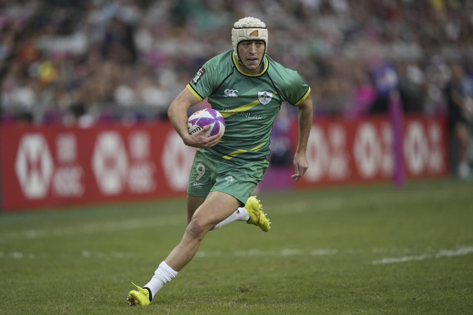 Ireland's Hugo Lennox runs to score during the men's third place match in the Hong Kong Sevens rugby tournament in Hong Kong, Sunday, April 7, 2024. (AP Photo/Louise Delmotte)